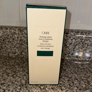 Oribe Priming Lotion in Cream and Green